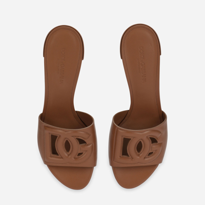 Shop Dolce & Gabbana Calfskin Mules With Dg Millennials Logo In Brown