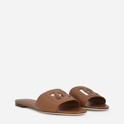 Shop Dolce & Gabbana Calfskin Sliders With Dg Millennials Logo In Brown