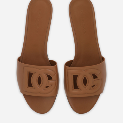 Shop Dolce & Gabbana Calfskin Sliders With Dg Millennials Logo In Brown