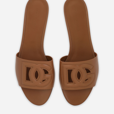 Dolce & Gabbana Slide Sandals With Cut Out Logo In Brown