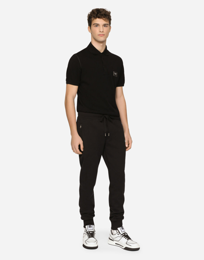 Shop Dolce & Gabbana Jersey Jogging Pants With Branded Tag In Black