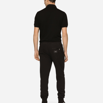 Shop Dolce & Gabbana Jersey Jogging Pants With Branded Tag In Black