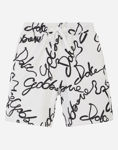 Shop Dolce & Gabbana Jersey Jogging Shorts With All-over Logo Print In White