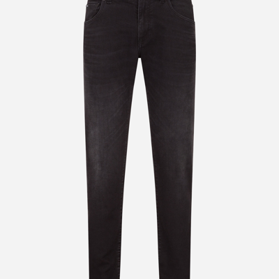 Shop Dolce & Gabbana Washed Black Slim-fit Stretch Jeans In Blue