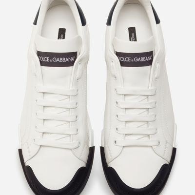 Shop Dolce & Gabbana Calfskin Nappa Portofino Sneakers With Rubber Toe In White/blue