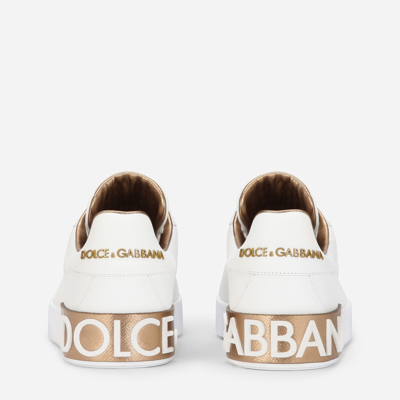 Shop Dolce & Gabbana Calfskin Nappa Portofino Sneakers With Lamé Details In Gold