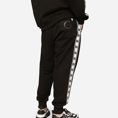 Shop Dolce & Gabbana Jersey Jogging Pants With Branded Bands In Black