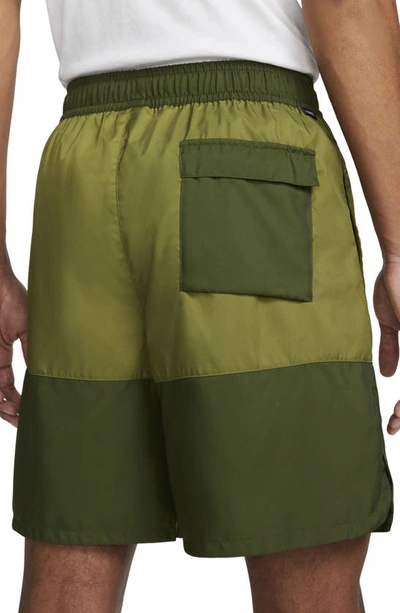 Shop Nike Essentials Colorblock Flow Shorts In Rough Green/ Pilgrim