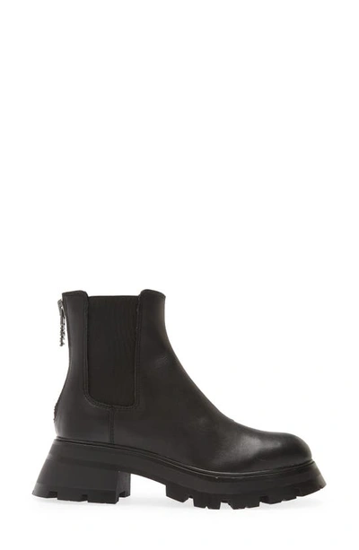 Shop Dkny Sasha Lug Chelsea Boot In Black Leather