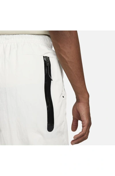 Shop Nike Sportswear Tech Essentials Unlined Woven Joggers In Phantom/ Black