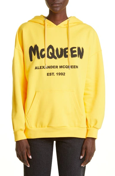Shop Alexander Mcqueen Graffiti Logo Cotton Hoodie In Pop Yellow / Black