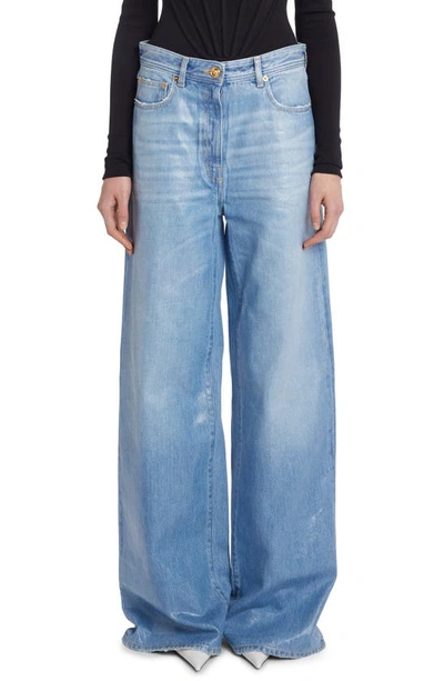 Shop Versace Laminated Rigid Wide Leg Jeans In Blu Medio