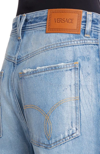 Shop Versace Laminated Rigid Wide Leg Jeans In Blu Medio