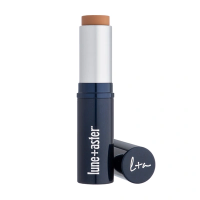 Shop Lune+aster Dawn To Dusk Foundation Stick In Deep Almond