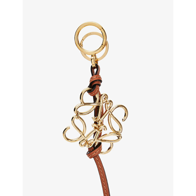 Shop Loewe Gold/tan Anagram Leather And Gold-toned Brass Charm