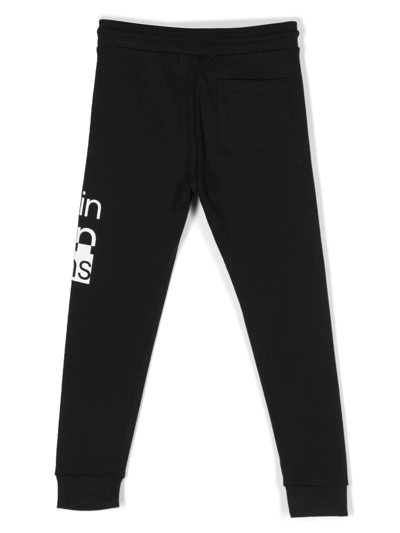 Calvin Klein Tie-dye Logo-print Track Pants In Black