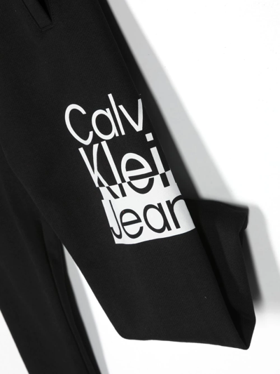Calvin Klein Tie-dye Logo-print Track Pants In Black