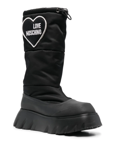 Shop Love Moschino Padded Heart Patch Boots In Black