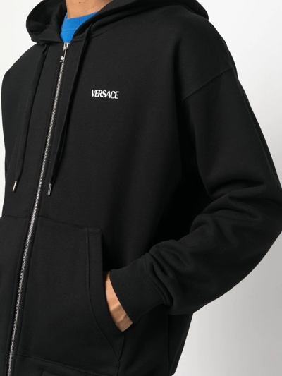 Shop Versace Logo-print Zip-fastening Hoodie In Schwarz