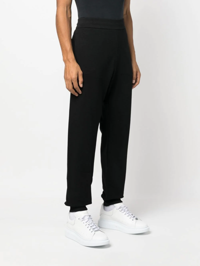 Shop Versace Logo-embroidered Track Pants In Schwarz