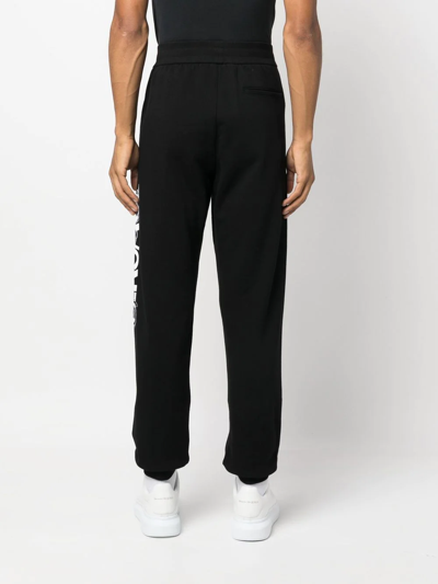 Shop Versace Logo-embroidered Track Pants In Schwarz