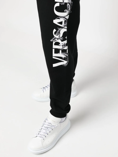 Shop Versace Logo-embroidered Track Pants In Schwarz