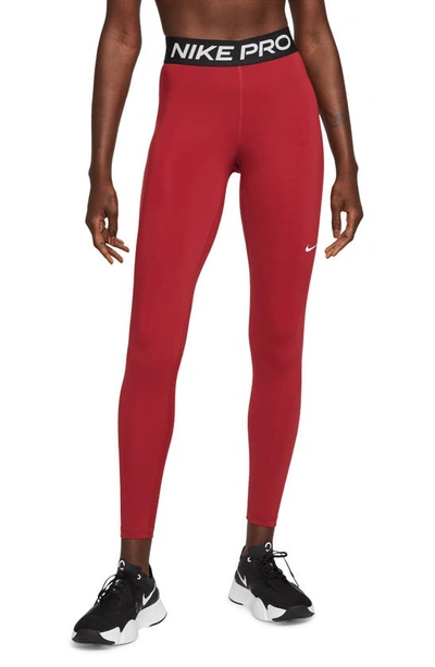 Shop Nike Pro Mid Rise Leggings In Pomegranate/ Black/ White