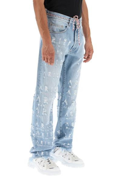 Shop Aries Distressed Lettering Motif Jeans In Light Blue,blue