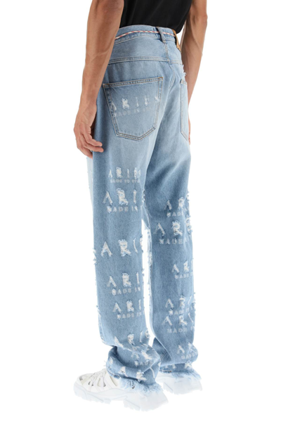 Shop Aries Distressed Lettering Motif Jeans In Light Blue,blue