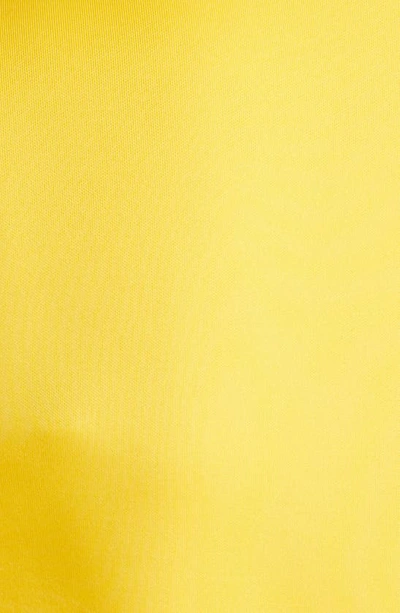 Nikki Lund Coco Sleeveless Peplum Top In Yellow