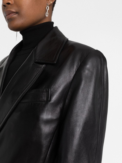 Shop Saint Laurent Double-breasted Leather Coat In Black