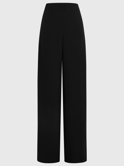 Shop Monot Trousers In Black