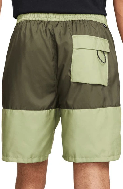 Shop Nike Essentials Colorblock Flow Shorts In Alligator/ Cargo Khaki/ White
