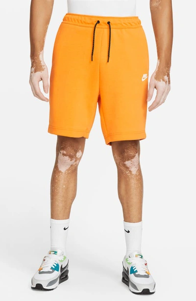 Shop Nike Sportswear Tech Fleece Shorts In Kumquat/ White