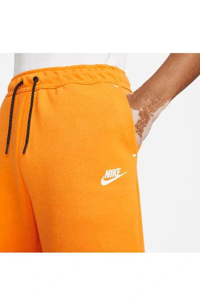 Shop Nike Sportswear Tech Fleece Shorts In Kumquat/ White