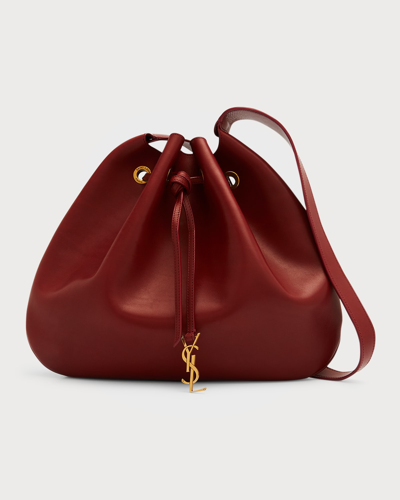 Shop Saint Laurent Large Ysl Drawstring Leather Hobo Bag In Sangria