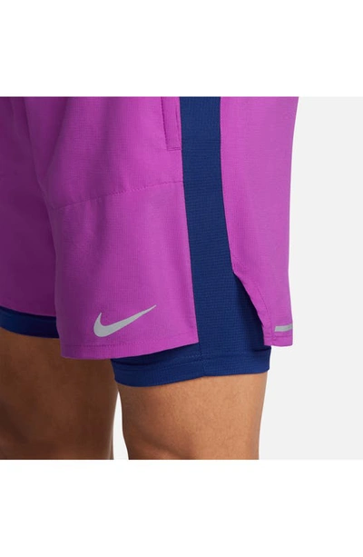 Shop Nike Dri-fit Stride Hybrid Running Shorts In Vivid Purple/ Deep Royal Blue