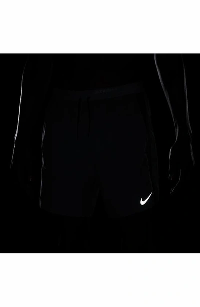 Shop Nike Dri-fit Stride Hybrid Running Shorts In Smoke Grey/ Dark Grey/ Black