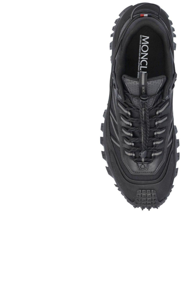 Shop Moncler Logo Detailed Lace-up Sneakers In Nero.