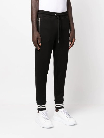 Shop Moncler Logo-patch Tapered Track Pants In Schwarz