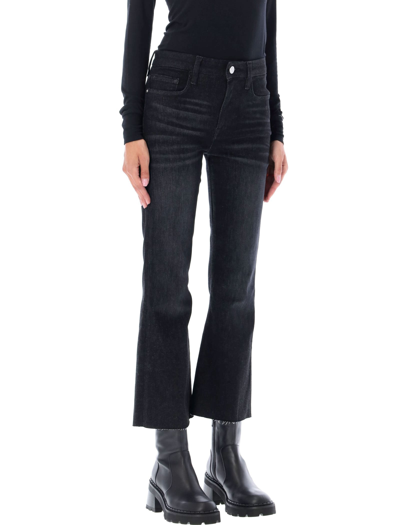 Shop Frame Le Cropped Mini Boot Jeans In Corvo Black