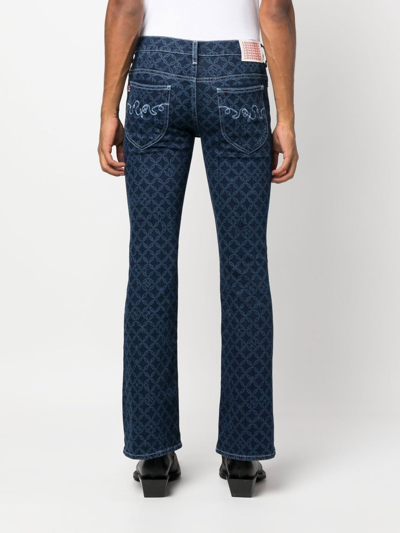 Shop Charles Jeffrey Loverboy Etchen-print Bootcut Jeans In Blue