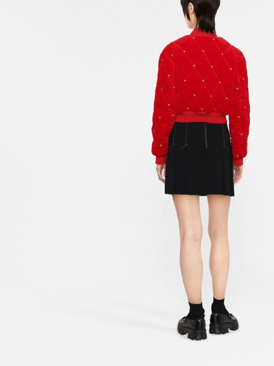 Shop Moschino Studded Cropped Bomber Jacket In Rot