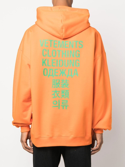 Shop Vetements Translation Logo-print Hoodie In Orange