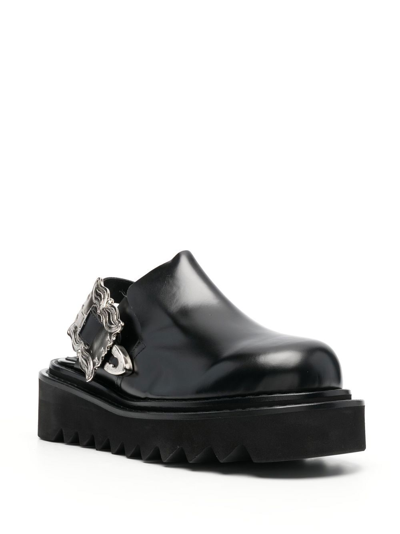 Shop Toga Buckled Leather Mules In Schwarz