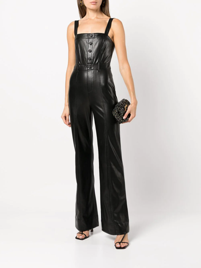 Shop Alice And Olivia Faux Leather Jumpsuit In Schwarz