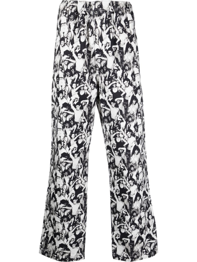 Shop Stussy Graphic-print Cotton Trousers In Schwarz