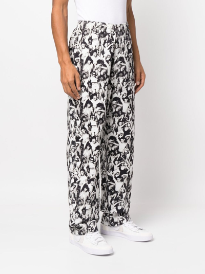 Shop Stussy Graphic-print Cotton Trousers In Schwarz