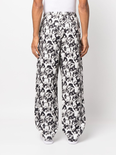 Shop Stussy Graphic-print Cotton Trousers In Schwarz