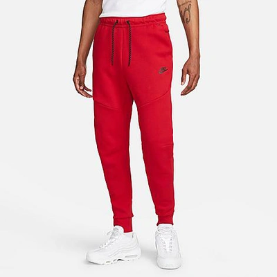 Shop Nike Tech Fleece Taped Jogger Pants In Gym Red/black